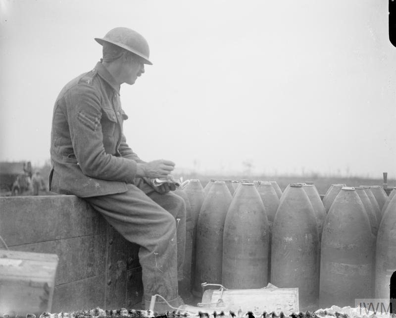 A Corporal checking shells arriving on a light railway. Wytschaete, 11 August 1917. © IWM (Q 5871)