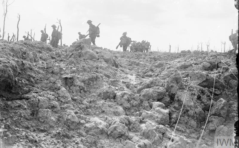 Battle of Langemarck. British troops moving forward over shell-torn ground near Pilckem, 16th August 1917. © IWM (Q 2708)